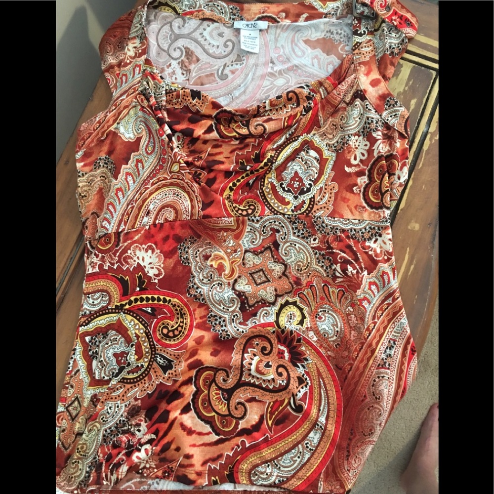 Cache rust paisley top with buckle accent.